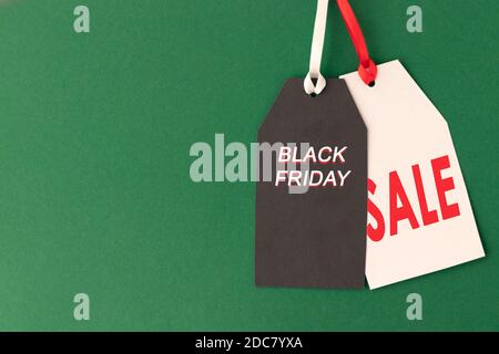 Black Friday sale two tags on green with copy space for text or ad. Black Friday concept. Copy space. Stock Photo
