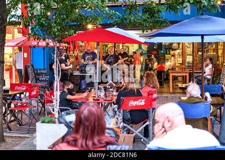 Buenos aires / Argentina; Nov 14, 2020: In front of a restaurant, during the coronavirus pandemic, Covid 19 outbreak: people at tables outside eating Stock Photo