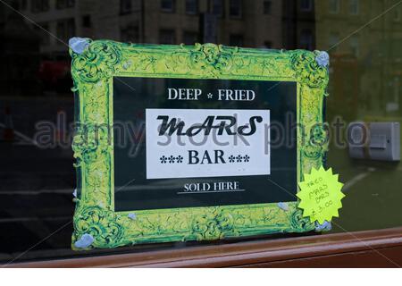 Deep Fried Mars Bar sign delicacy for sale in a Scottish Fish and Chip shop Stock Photo