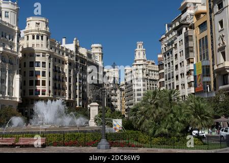 Valencia,Spain-October 11 ,2020:View of City hall square (Plaza del Ayuntamiento)with the fountain and palms, in city center of Valencia, Spain. Stock Photo