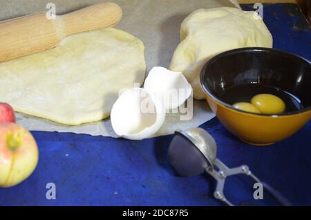 Various ingredients for winter seasonal baking and other recipes, honey, apples, herbs and spices on a dark blue background. Top view. Stock Photo