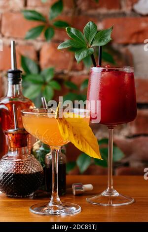 autumn cocktails on a brick wall background