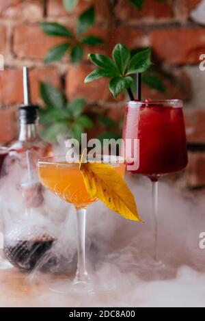 autumn cocktails on a brick wall background Stock Photo
