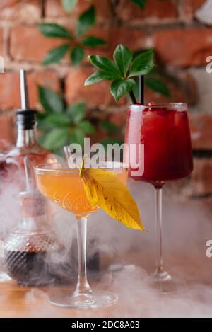 autumn cocktails on a brick wall background Stock Photo