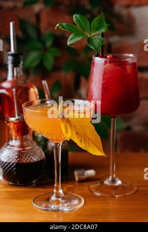 autumn cocktails on a brick wall background Stock Photo