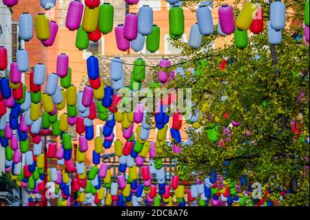 London, UK. 19th Nov, 2020. Chinatown is decorated with colourful lanterns in response to difficult times for retailers and the catering industry as the second Coronavirus lockdown continues. Many people wear masks, even outside. Credit: Guy Bell/Alamy Live News Stock Photo