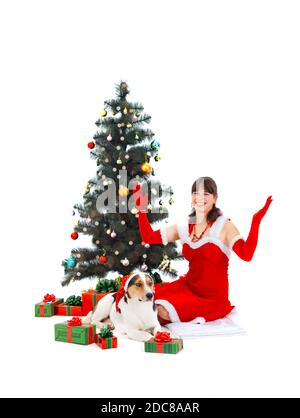 Healthy young woman and dog with gifts and christmas tree for christmas on white isolated background Stock Photo