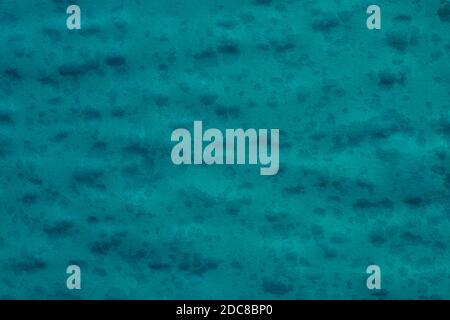 dark blue green paper sheet background with raindrops, green tide color, trend, pattern, texture. Stock Photo