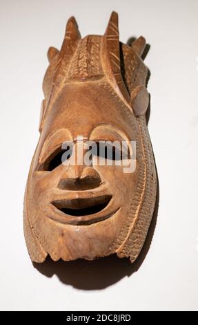 African wooden carved vertical mask handmade from the 80's Stock Photo