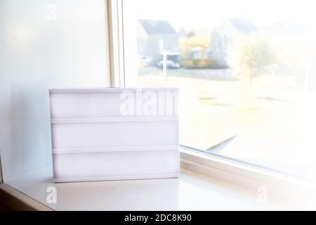 Blank empty Lightbox on window silk in a bright room with daylight, copy space or space for text. Modern design background Stock Photo