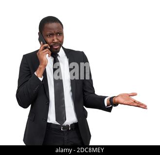 Closeup of angry young african man screaming while talking on smartphone isolated on white background  Stock Photo