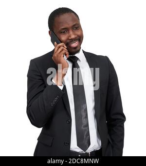 Portrait of african man smiling while talking on the phone with grey wall isolated on white background  Stock Photo