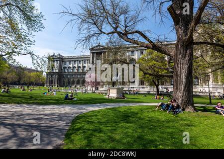 People lying on the lawn in Burggarten, Vienna, Austria. Stock Photo