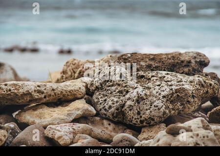 Volcanic rock on the caribbean shore of St. Lucia Stock Photo