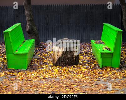 Empty park bench in the city Stock Photo