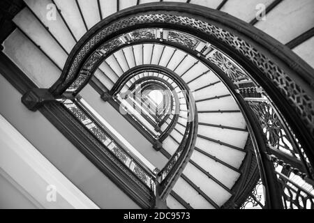 classic winding staircase steps in spiral shape form low angle view Stock Photo