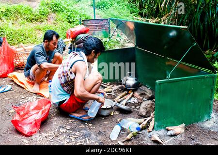 Guide Preparing Lunch on the First Day of the Three Day Trek up Mount Rinjani, Lombok, Indonesia, Asia Stock Photo