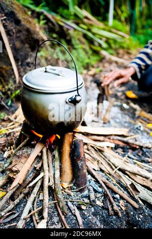 Tea Pot Boiling over the Camp Fire on the First Day of the Three Day Trek up Mount Rinjani, Lombok, Indonesia, Asia Stock Photo