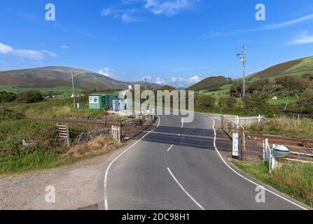 Kirksanton manually operated level crossing with gates on the Cumbrian coast railway line, UK Stock Photo