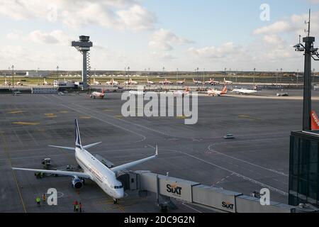 05.11.2020, Schoenefeld, Brandenburg, Germany - View of the apron from the visitor's terrace of Berlin Brandenburg BER Airport. There are parked airpl Stock Photo