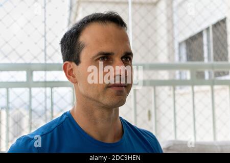 43 year old man in blue shirt looking at the diagonal. Stock Photo