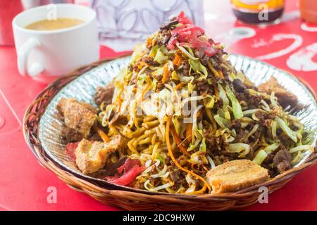 A bowl of a regional noodle dish called pansit batil patung at a local noodle house in Makati City, Philippines Stock Photo