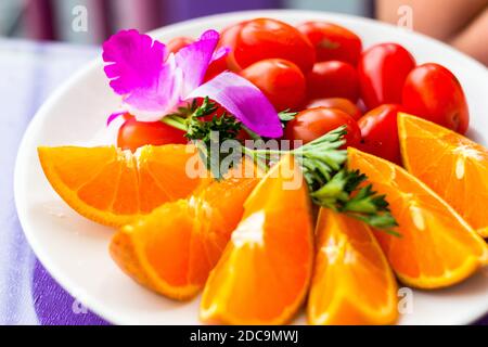 Orange and cherry tomato platter at a restaurant in Taipei, Taiwan Stock Photo