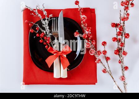 Christmas table setting with red berry branch. Christmas decoration. Stock Photo