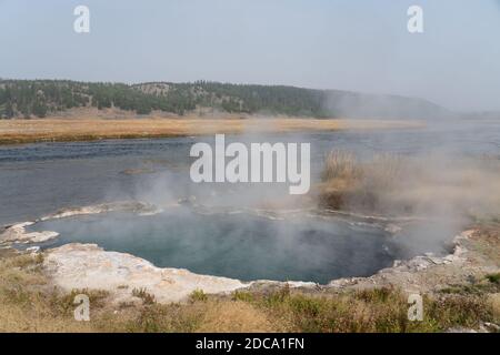 The Maiden's Grave Spring by the Firehole RIver on the Fountain Flats Drive in Yellowstone National Park in Wyoming, USA. Stock Photo