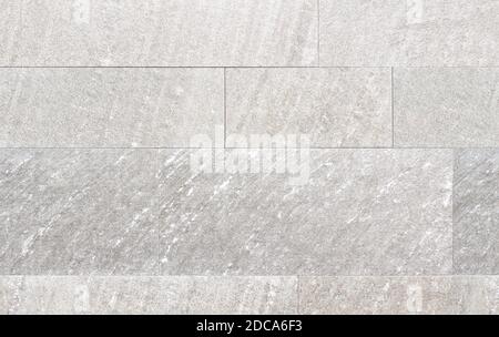 Detail of a wall cladding made of gray rectangular stone tiles Stock Photo