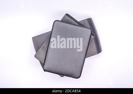 HDD - Stack of Portable Hard Disk Drives isolated on white background. Pile of External hard disk drives. Stock Photo