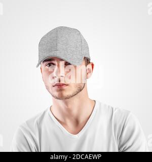 Mockup of gray baseball cap heather on a guy's head, isolated on background. Blank panama template with visor for design presentation. Sun protection Stock Photo