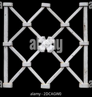 Fragment of a homemade metal fence painted white. Isolated on black Stock Photo