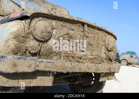 Dirty jeep after the race in summer Stock Photo