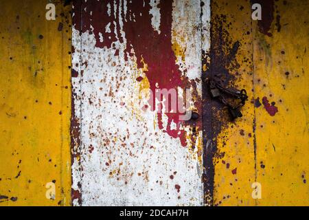 A corroded door into an engine room is seen on the deck of an old gold dredge anchored in the Atrato river in Quibdó, Colombia. Stock Photo