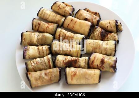 Plate with cheese Stuffed Eggplant on table Stock Photo