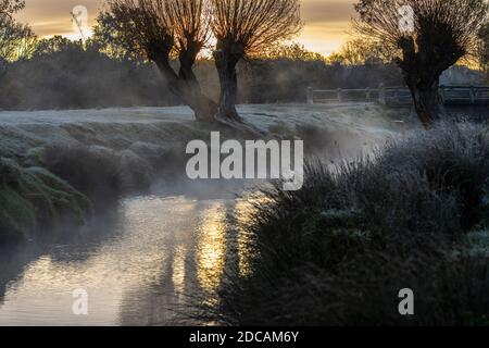 Richmond Upon Thames, London. 20th Nov 2020. UK Weather: Early morning mist rises over Beverly Brook on a cold frost covered landscape at Richmond Park in west London on a bright Autumn morning, Richmond Upon Thames, England, UK 20th November 2020, England, United Kingdom Credit: Jeff Gilbert/Alamy Live News Stock Photo