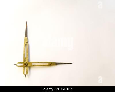 Brass reduction compass or proportional scale divider. Geometry tool used to scale up or down designs and in navigation to transfer distance on charts Stock Photo