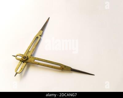 Brass reduction compass or proportional scale divider. Geometry tool used to scale up or down designs and in navigation to transfer distance on charts Stock Photo