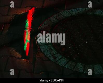 Colorful Reflections in evening rainy weather. Stock Photo