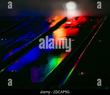 Colorful Reflections in evening rainy weather. Stock Photo