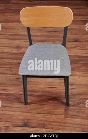 Grey color kitchen chair stay on wooden floor Stock Photo