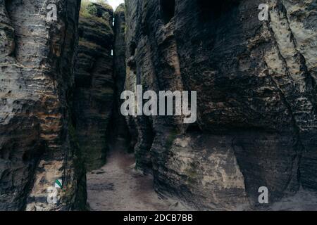 Rock sandstone with signs for use in the field. A sign that lines a hiking trail. Tisa walls in Bohemian Switzerland autumn fall dramatic view Stock Photo