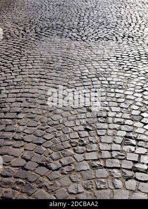 Antique granite cobblestone street pavement. Abstract geometrical background. Stock Photo
