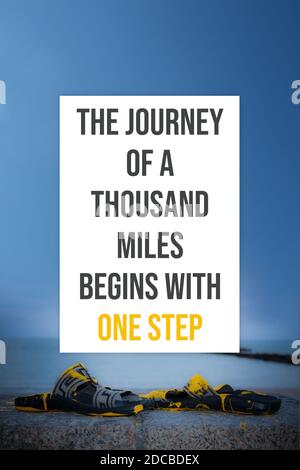 The journey of a thousand miles begins with one step motivational quotes Stock Photo