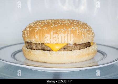 Cooking, heating food in the microwave. Baked potatoes with meat,  vegetables on a white plate in the microwave top view Stock Photo - Alamy