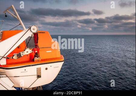 Emergency life raft or life boat on board a ferry between Corsica and Nice France. Stock Photo