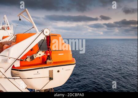 Emergency life raft or life boat on board a ferry between Corsica and Nice France. Stock Photo