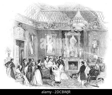 The Yellow Drawing-Room, Buckingham Palace, 1844. Interior of the London residence of the British royal family: 'the most superb of the entire range of rooms that occupy the western or garden front of the first story, and the northernmost in the suite. Its height is 32 feet, and its form nearly square...the main beauty of the apartment lies in the harmony of colour adopted for its draperies...namely, a series of shades of yellow...Thus, the walls are hung with figured yellow silk, and the window draperies are of similar costly material; as are the sofas, chairs, seats...at each end, and above Stock Photo