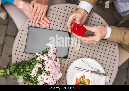 Beautiful senior couple dating outdoors - Mature couple celebrating marrige proposal , concepts about elderly and lifestyle Stock Photo